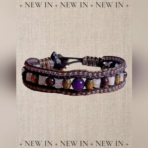 Attract love with this rose quartz and garnet beaded cuff bracelet.